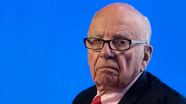 headshot of Rupert Murdoch on blue background